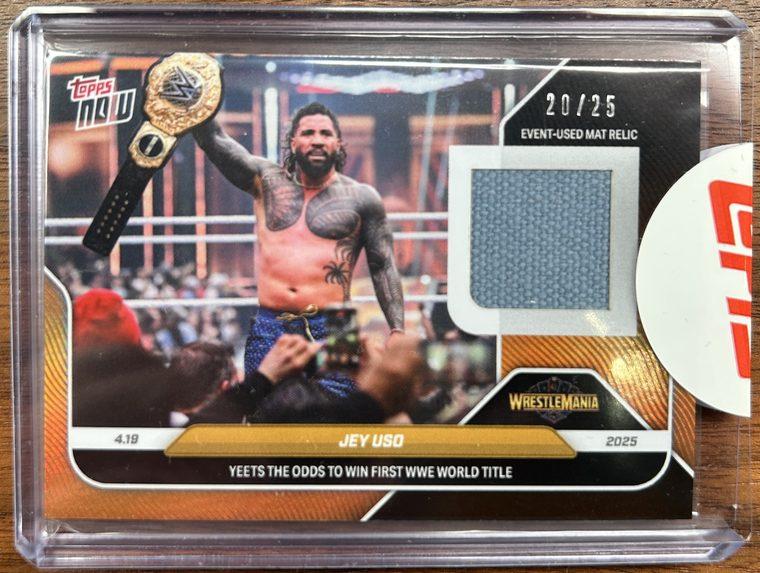 A Jey Uso Topps Now relic card in a factory-sealed toploader with a Topps sticker